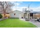 The backyard features a patio with a hot tub, seating area, and storage shed at 3336 W 35Th Ave, Denver, CO 80211