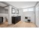 The bathroom features a double vanity with black cabinets and tile floors at 3336 W 35Th Ave, Denver, CO 80211