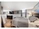 Finished basement bedroom featuring a large bed, wood floors, and recessed lighting at 3336 W 35Th Ave, Denver, CO 80211