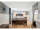 This bedroom features wood floors, neutral walls, and a comfortable bed, creating a relaxing atmosphere at 3336 W 35Th Ave, Denver, CO 80211