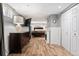 View of the bedroom space with wood floors, a fireplace, and closet at 3336 W 35Th Ave, Denver, CO 80211