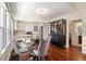 The dining area features hardwood floors, great light, and provides access to the adjacent rooms at 3336 W 35Th Ave, Denver, CO 80211