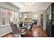Bright kitchen features stainless steel appliances, granite countertops, and adjacent dining area with hardwood floors at 3336 W 35Th Ave, Denver, CO 80211