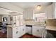 Bright kitchen with stainless appliances, granite countertops, and easy access to the adjacent living areas at 3336 W 35Th Ave, Denver, CO 80211