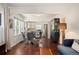 Inviting living room seamlessly connects to a modern kitchen and dining area with beautiful hardwood floors at 3336 W 35Th Ave, Denver, CO 80211