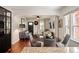 Inviting living room and dining area with hardwood floors, lots of light, and seamlessly connected spaces at 3336 W 35Th Ave, Denver, CO 80211