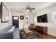 Inviting living room with hardwood floors, modern decor, and comfortable seating arrangement at 3336 W 35Th Ave, Denver, CO 80211