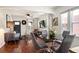 Open-concept living area showcasing hardwood floors, natural light, and seamless flow to the dining room at 3336 W 35Th Ave, Denver, CO 80211