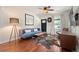 Cozy living room featuring hardwood floors, comfortable seating, and great natural light at 3336 W 35Th Ave, Denver, CO 80211