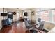 Combined living area with sleek hardwood floors and cozy seating area with a nearby dining table at 3336 W 35Th Ave, Denver, CO 80211