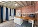 The office boasts rustic brick walls, wood accents, and comfortable seating at 3336 W 35Th Ave, Denver, CO 80211