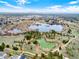 Breathtaking aerial view of a park with two lakes and walking paths, with a city skyline in the distance at 638 S Dudley St, Lakewood, CO 80226