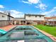 Large backyard featuring a covered pool, lawn area, and space for outdoor entertaining at 638 S Dudley St, Lakewood, CO 80226