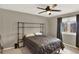 Bedroom with a large industrial style headboard and shelving unit and neutral paint at 638 S Dudley St, Lakewood, CO 80226