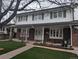 Charming two-story brick and siding home with a covered porch and a well-maintained front lawn at 638 S Dudley St, Lakewood, CO 80226