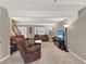 Spacious living room with natural light, cozy seating, and neutral tones throughout at 638 S Dudley St, Lakewood, CO 80226