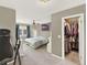 Comfortable main bedroom with a ceiling fan, large closet and ample space for relaxation at 638 S Dudley St, Lakewood, CO 80226