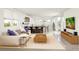 Open living area featuring a sofa, entertainment center, and an open bar area at 4444 W 28Th Ave, Denver, CO 80212