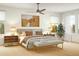 Bedroom with ceiling fan, carpet, and an upholstered bench at the foot of the bed at 4444 W 28Th Ave, Denver, CO 80212