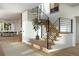 Staircase featuring natural wood steps, black metal railings, and large art piece hanging on the wall at 4444 W 28Th Ave, Denver, CO 80212