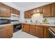 View of kitchen with updated appliances at 428 S Uvalda St, Aurora, CO 80012