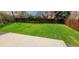 Spacious backyard featuring a privacy fence, concrete patio and a well-maintained lawn at 6521 Zinnia St, Arvada, CO 80004