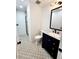 Bathroom featuring a single sink vanity, neutral paint, and glass enclosed shower at 6521 Zinnia St, Arvada, CO 80004