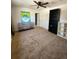 Spacious bedroom with neutral carpet, a dresser and a decorative art piece at 6521 Zinnia St, Arvada, CO 80004
