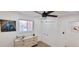 Bedroom with carpet floors, ceiling fan and picture window at 6521 Zinnia St, Arvada, CO 80004