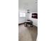 Bright office space featuring modern desk and neutral carpet under a ceiling fan with views from basement window at 6521 Zinnia St, Arvada, CO 80004