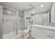 Bathroom featuring a glass shower and white vanity at 15547 W Vassar Ave, Lakewood, CO 80228