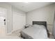 Bright bedroom with neutral colors, closet and carpeted floors at 15547 W Vassar Ave, Lakewood, CO 80228