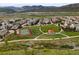Enjoy the community park with paths, a tennis court, covered gazebo, and stunning mountain views in this vibrant neighborhood at 15547 W Vassar Ave, Lakewood, CO 80228