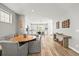 Open dining room area with a round table and built-in seating near the kitchen at 15547 W Vassar Ave, Lakewood, CO 80228