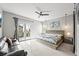 Spacious main bedroom with contemporary decor including ceiling fan, light fixture, and outside access at 15547 W Vassar Ave, Lakewood, CO 80228