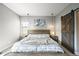 Relaxing main bedroom with modern furnishings, light color palette and stylish decor at 15547 W Vassar Ave, Lakewood, CO 80228