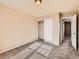 This bedroom has neutral walls, carpet and a closet at 5888 Biscay St # D, Denver, CO 80249