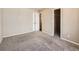 This bedroom offers neutral walls, closet, and carpet at 5888 Biscay St # D, Denver, CO 80249