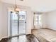 Light-filled dining room with sliding glass door and adjacent living space at 5888 Biscay St # D, Denver, CO 80249