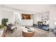 Living room area with dining room and kitchen at 5888 Biscay St # D, Denver, CO 80249
