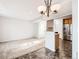 View of open-concept living room leading into kitchen with stainless steel appliances at 5888 Biscay St # D, Denver, CO 80249