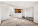 View of the living room open to the kitchen with bar and breakfast nook at 5888 Biscay St # D, Denver, CO 80249