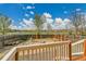 Spacious backyard with wood fence, fire pit, and view of open field at 21455 E 44Th Ave, Denver, CO 80249