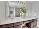 Bathroom with a double sink vanity with large mirror at 21455 E 44Th Ave, Denver, CO 80249