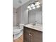 Bathroom featuring modern light fixture, shower, bath, and toilet at 21455 E 44Th Ave, Denver, CO 80249