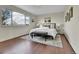 Bright bedroom with wooden floors and a large window overlooking the landscape at 21455 E 44Th Ave, Denver, CO 80249