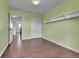Bedroom featuring hardwood flooring, built in shelving and a closet at 21455 E 44Th Ave, Denver, CO 80249