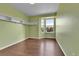 Bedroom featuring a bay window, hardwood flooring and built in shelving at 21455 E 44Th Ave, Denver, CO 80249