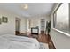 Spacious bedroom featuring wooden floors, large window, and closet at 21455 E 44Th Ave, Denver, CO 80249