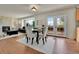 Spacious dining area with stylish furniture, access to the backyard, fireplace, and a view of the living area at 21455 E 44Th Ave, Denver, CO 80249